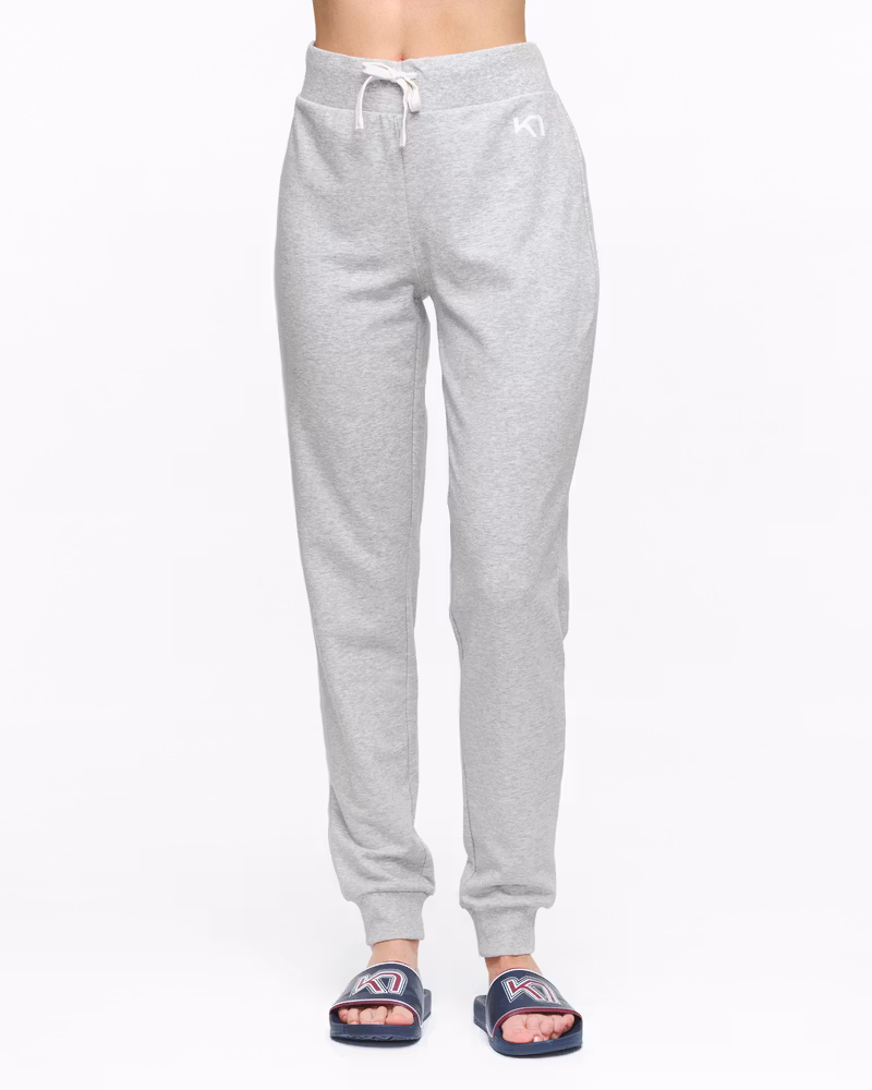 Woman wearing light grey Kari Traa Kari Pants, showing the comfortable fit for lounging or days around town.