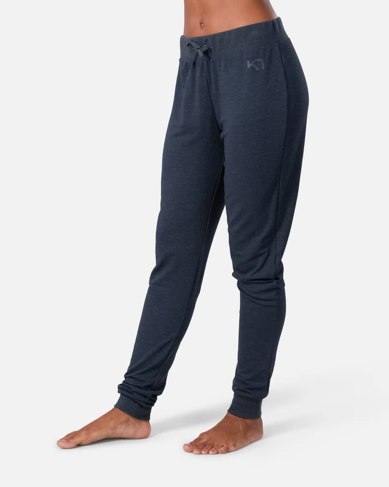 Woman wearing navy Kari Traa Kari Pants, showing the slim leg and comfortable fit for casual wear.