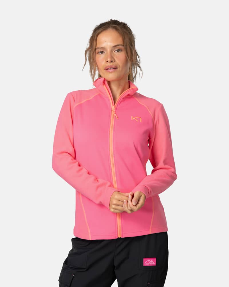 Woman wearing the pink Kari Traa Kari Full Zip Fleece, perfect for staying warm during outdoor adventures.