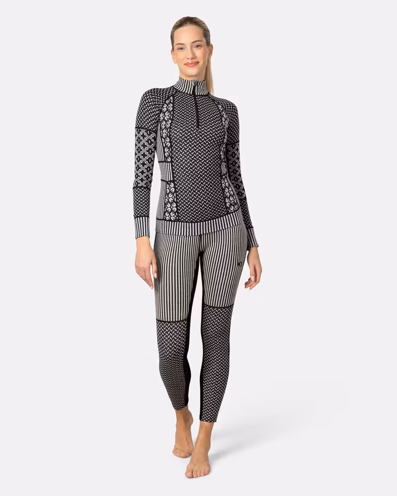 Woman styled in the complete black Kari Traa Smekker baselayer set for a coordinated, warm outfit.