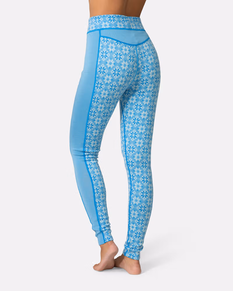 Back view of the light blue Kari Traa Rose High Waisted Baselayer Pants, highlighting the seamless construction.