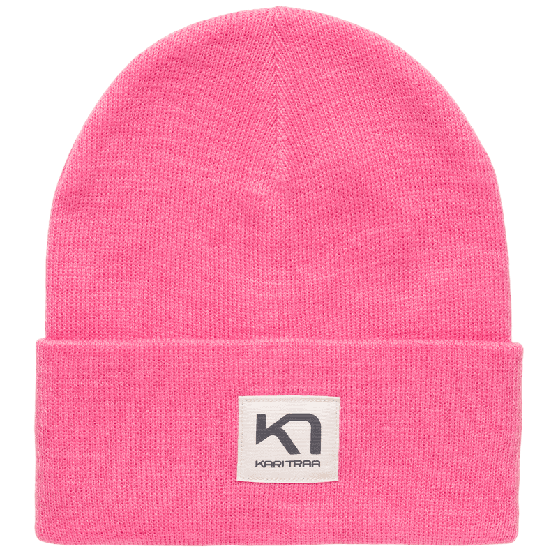 Pastel peach Kari Traa Røthe Beanie, a double-layer winter cap with a fold-up hem and classic logo patch for urban style.