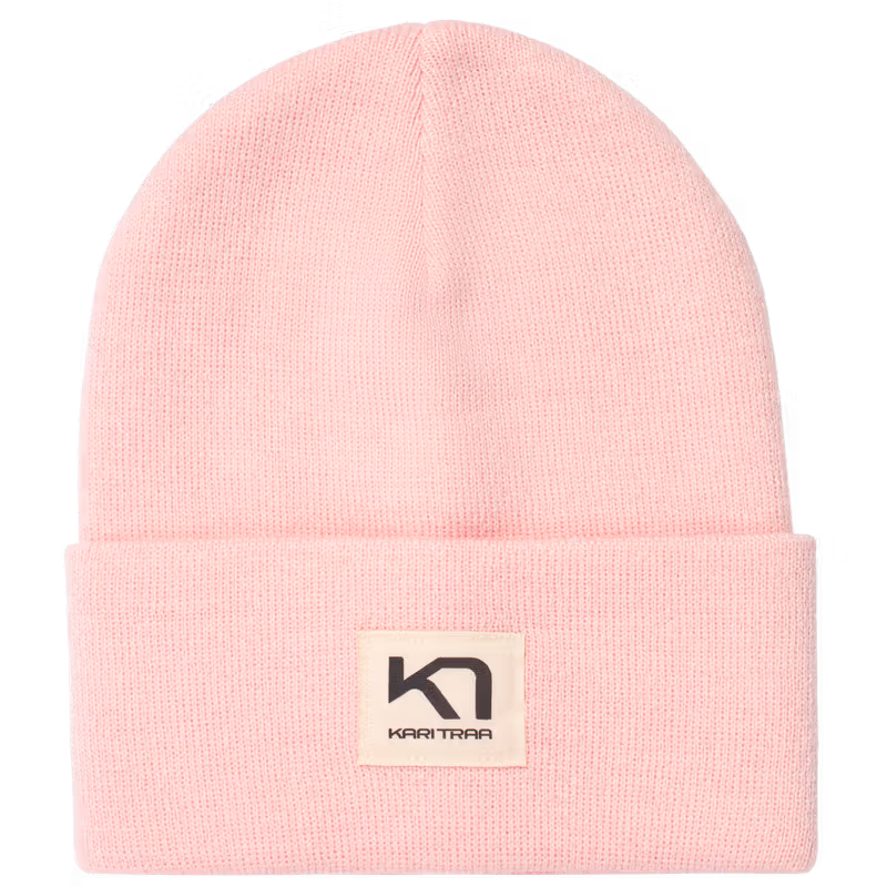 Kari Traa Røthe Beanie in light pink, a rib-knit winter hat with a classic fold-up hem and a woven logo patch.