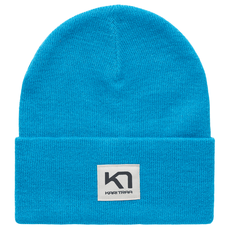 Bright blue Kari Traa Røthe Beanie in a casual rib knit, perfect for hikes, camping, or cool summer evenings.