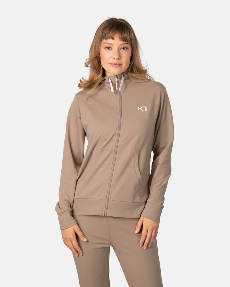 Woman wearing the Kari Traa Kari Hoodie in mocha brown, showing its comfortable fit for casual or loungewear.