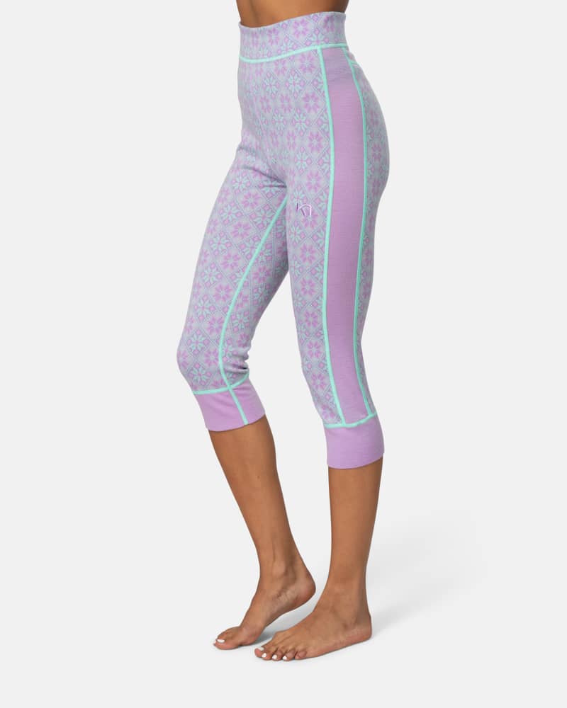 Side view of a woman wearing the lavender Kari Traa Rose High Waist Capri, showing the cropped length and slim fit.
