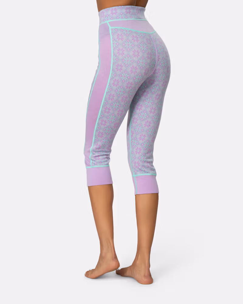 Back view of a woman in lavender Kari Traa Rose High Waist Capri, highlighting the flattering high waist.