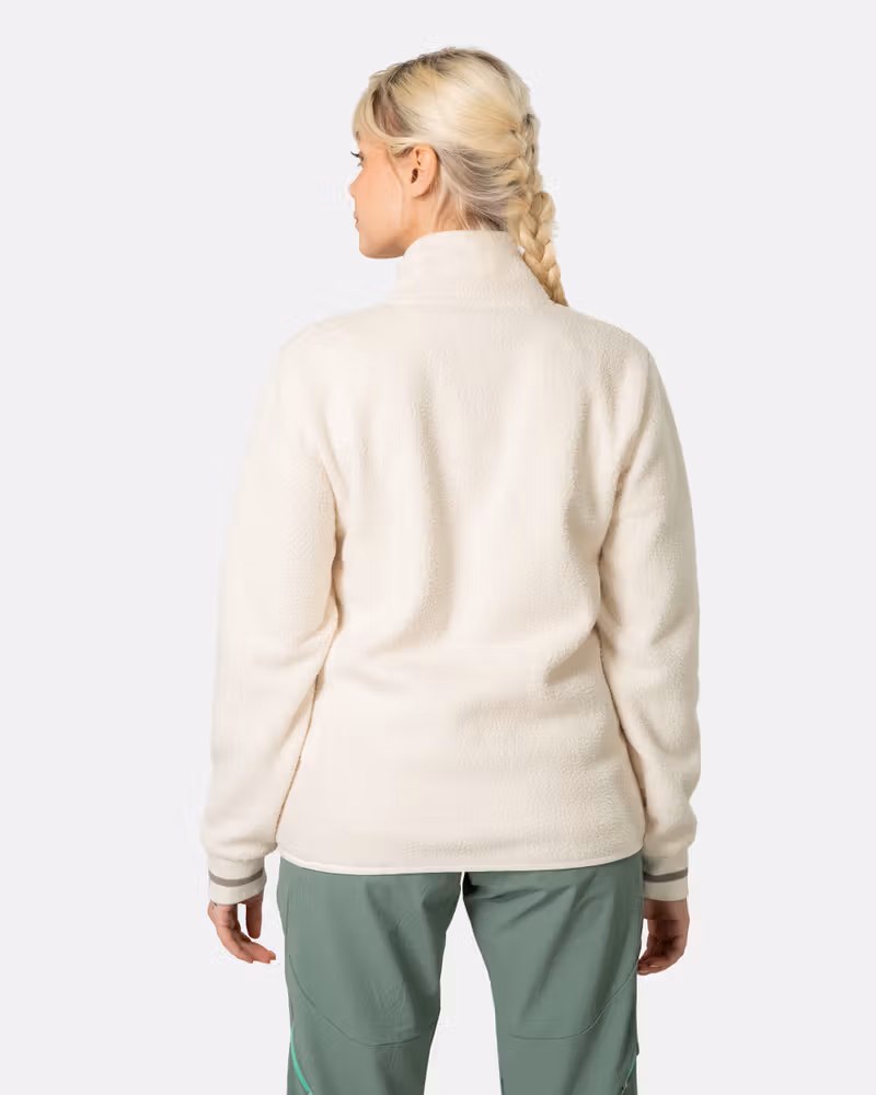 Back view of a woman in the cream Kari Traa Røthe Midlayer, showing the cozy pile material and regular fit.