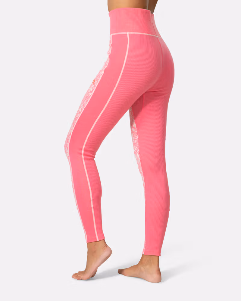 Back view of a woman in pink Kari Traa Anna High Waist Pants, highlighting the high-waist fit.