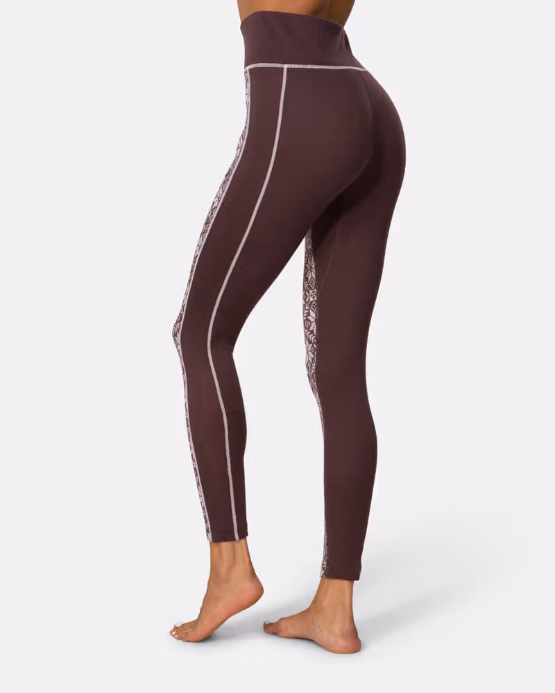 Side view of the dusty rose Kari Traa Anna High Waist Pants, highlighting the slim, flattering fit.