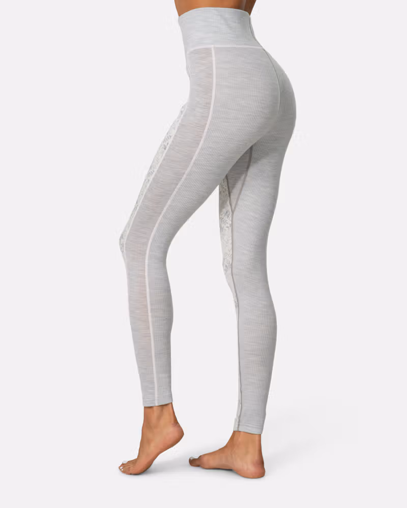 Back view of a woman in grey Kari Traa Anna High Waist Pants, showing the high-waist coverage.