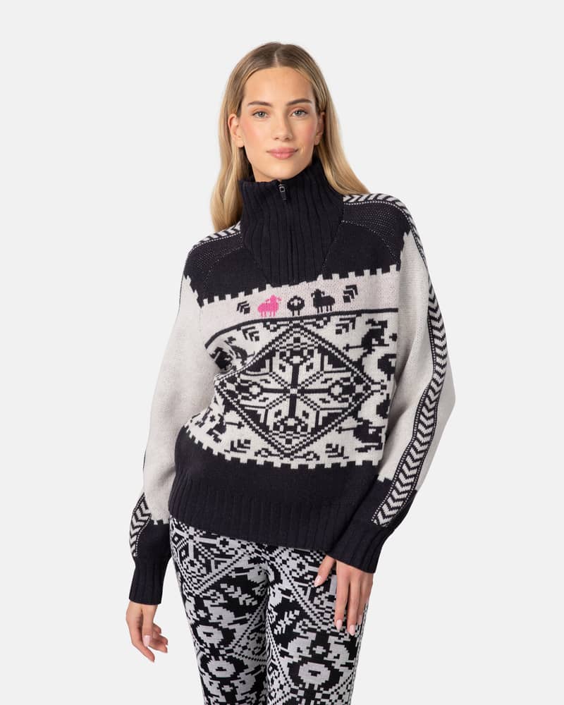 Woman wearing the black and white Kari Traa Saga Knit sweater, showing the bold Scandinavian-inspired pattern.