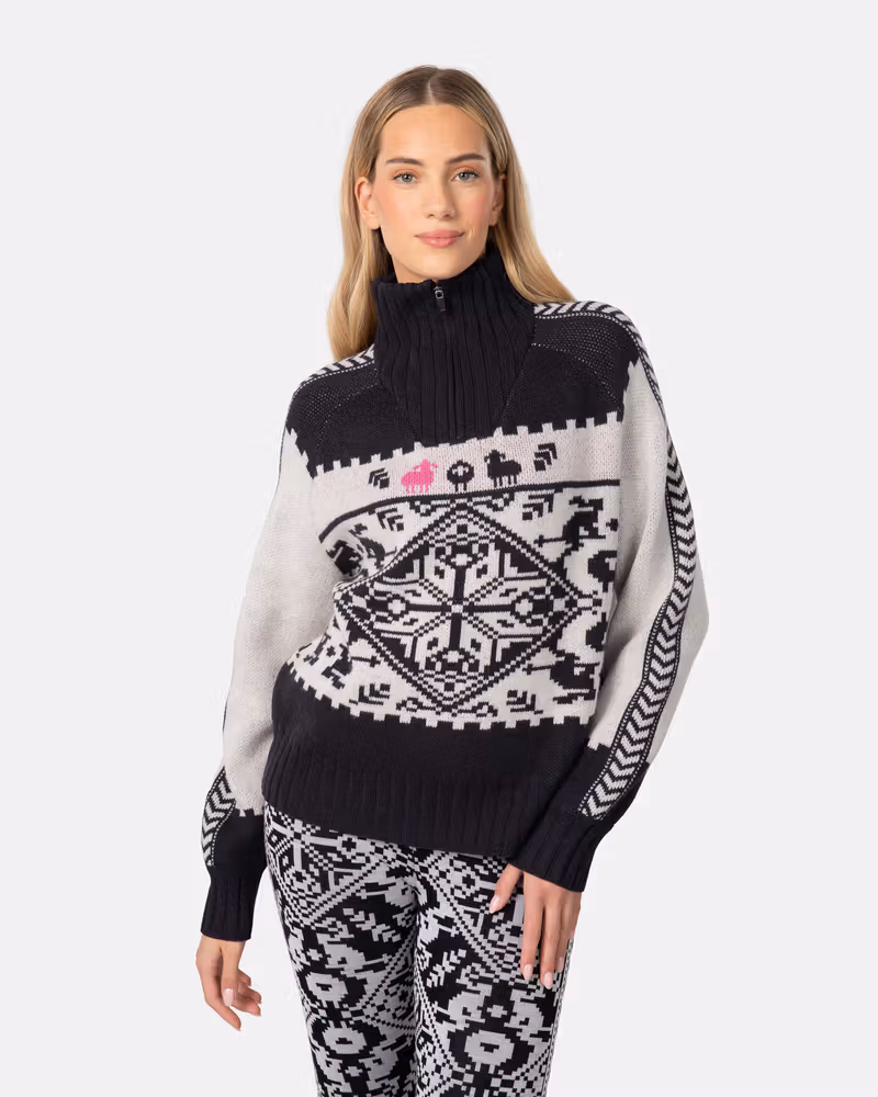 Woman wearing the black and white Kari Traa Saga Knit sweater, showing the bold Scandinavian-inspired pattern.