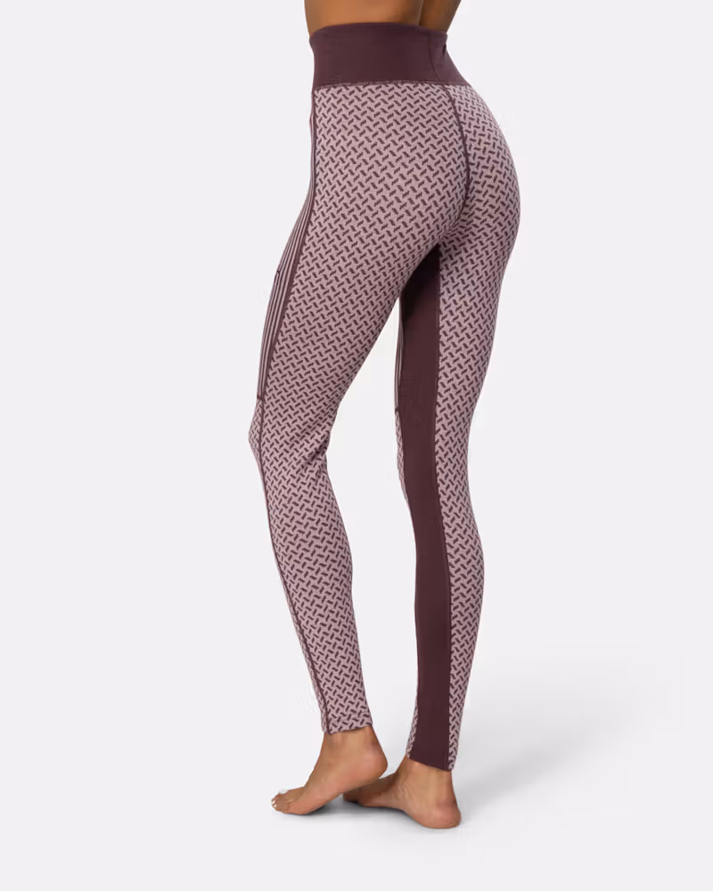 Back view of the dusty rose Kari Traa Smekker High Waist Pants, highlighting the slim, comfortable fit.