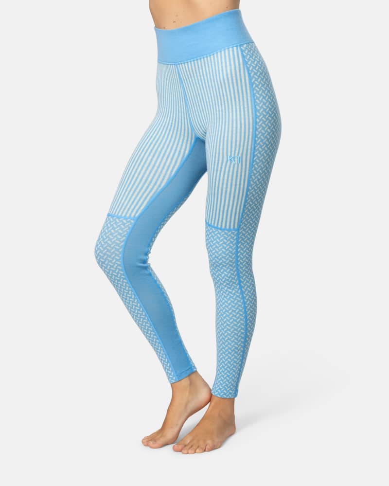 Side view of a woman in light blue Kari Traa Smekker High Waist Pants, showcasing the patterned design.
