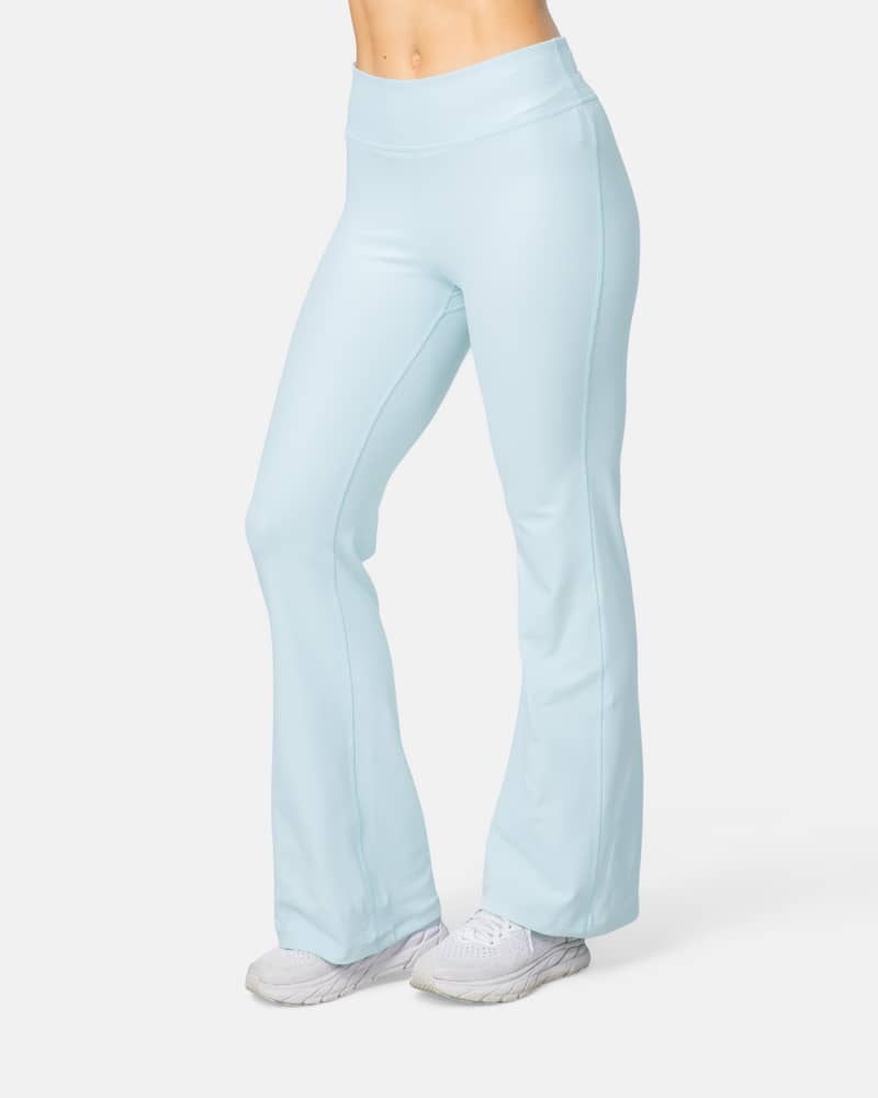 Woman wearing the Kari Traa Nina Flare Tights in light blue, a flattering high-waist legging for gym or everyday wear.