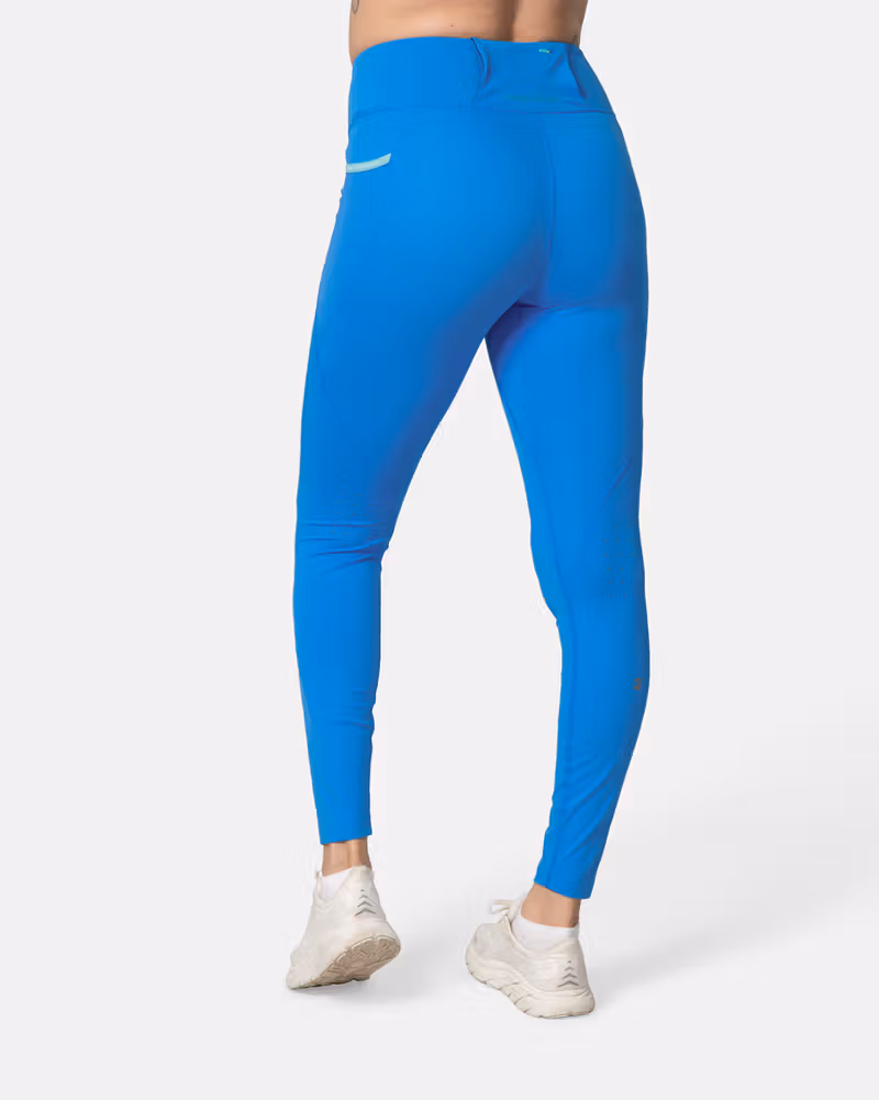 Back view of the horizon blue Kari Traa Nia Tights, highlighting the flattering fit and secure back pocket.