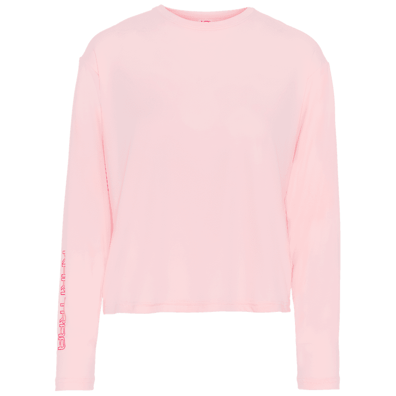 Kari Traa Una Long Sleeve in pastel pink, a soft, quick-drying layer with 40+ UPF protection for sunny days.