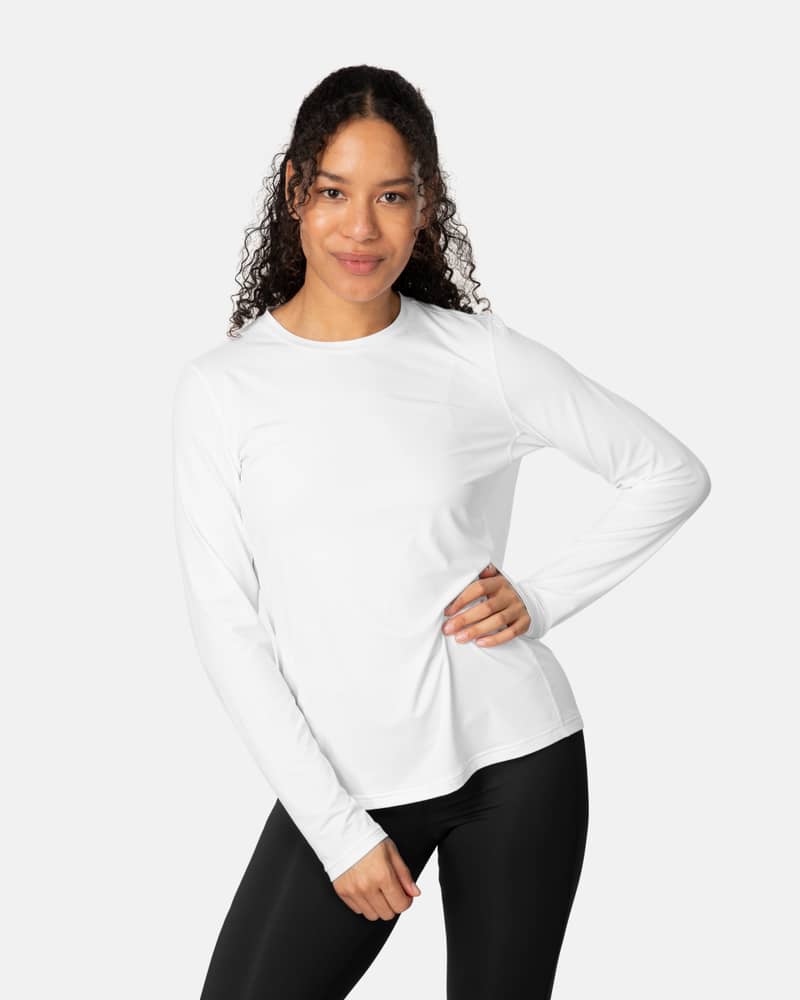 Woman wearing the white Kari Traa Ava Long Sleeve, a versatile training shirt styled for a workout.