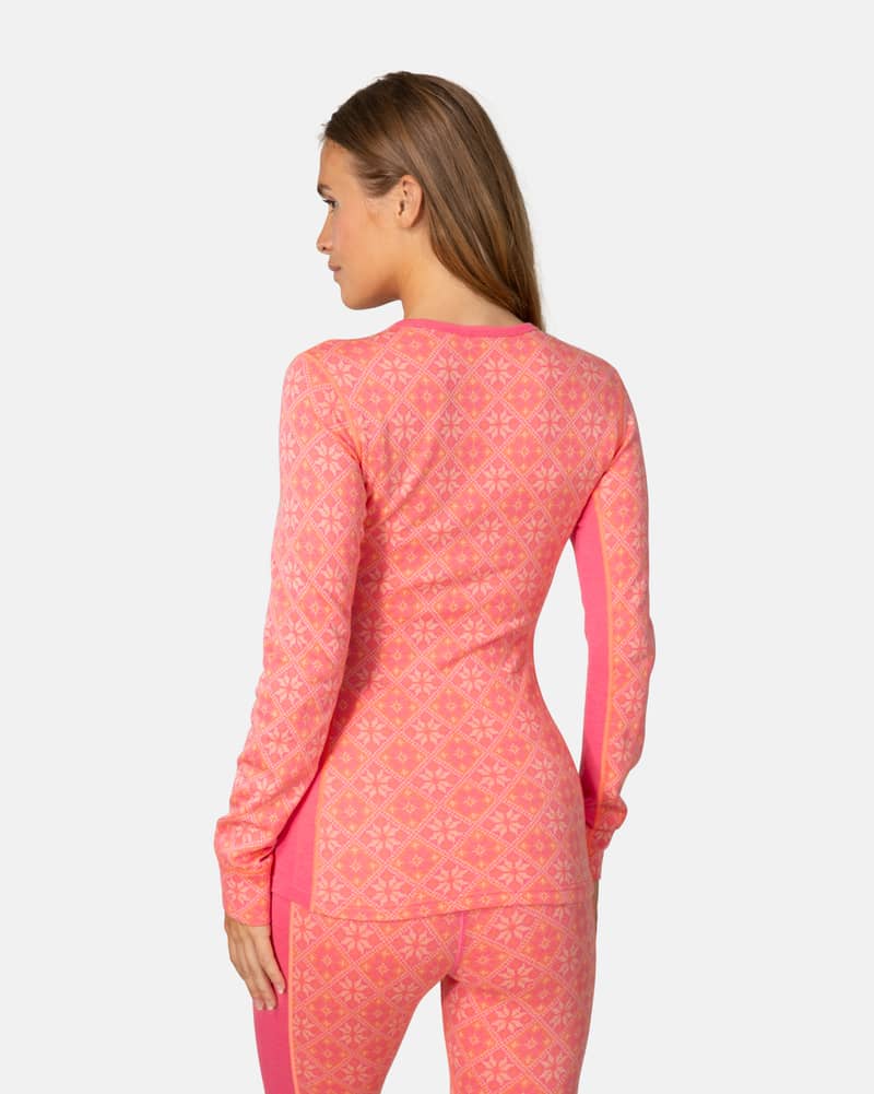 Back view of a woman in the pink Kari Traa Rose Long Sleeve 2.0, showcasing the slim, athletic fit.